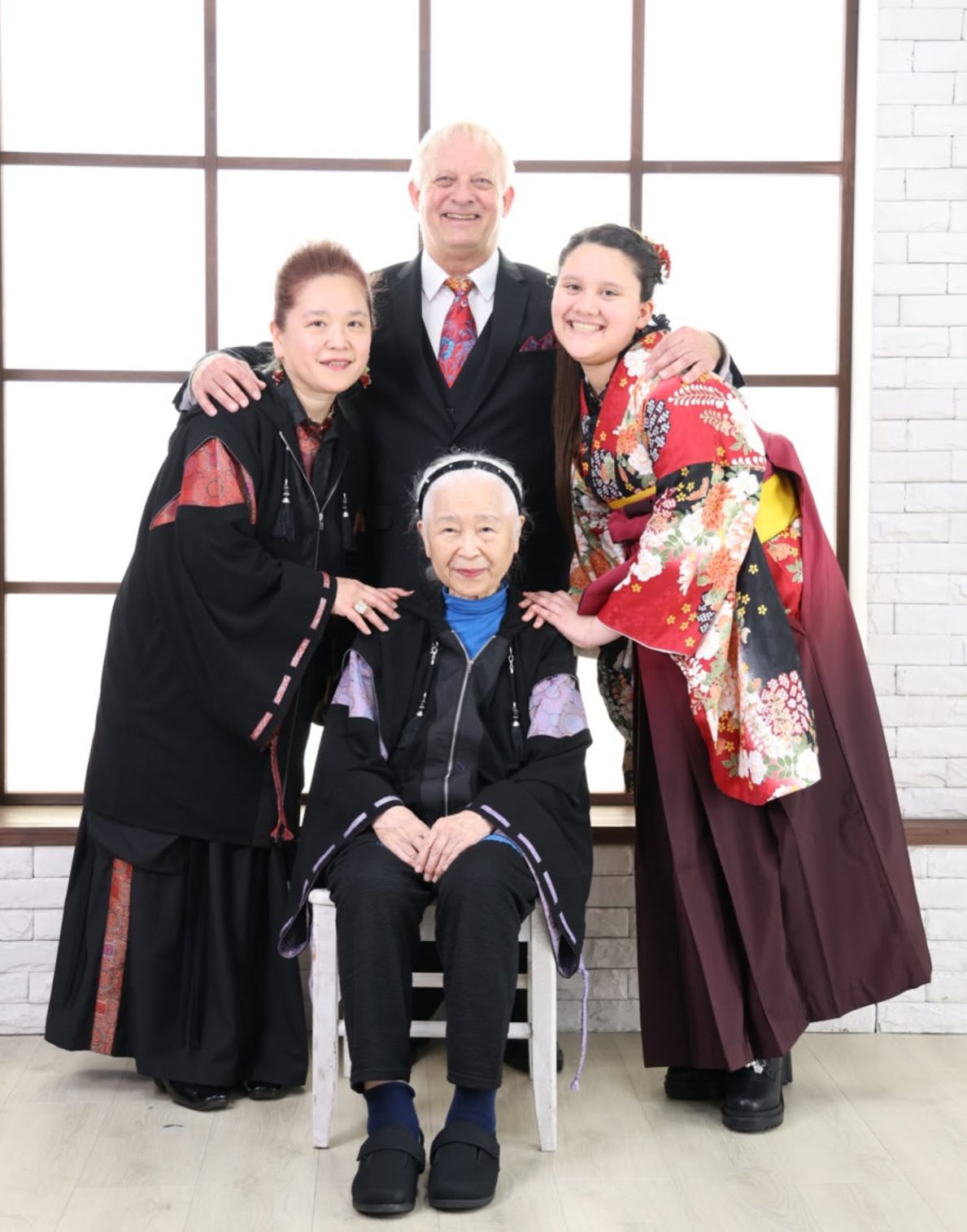 Mike Noack with his wife, daughter, and mother-in-law in a formal family portrait