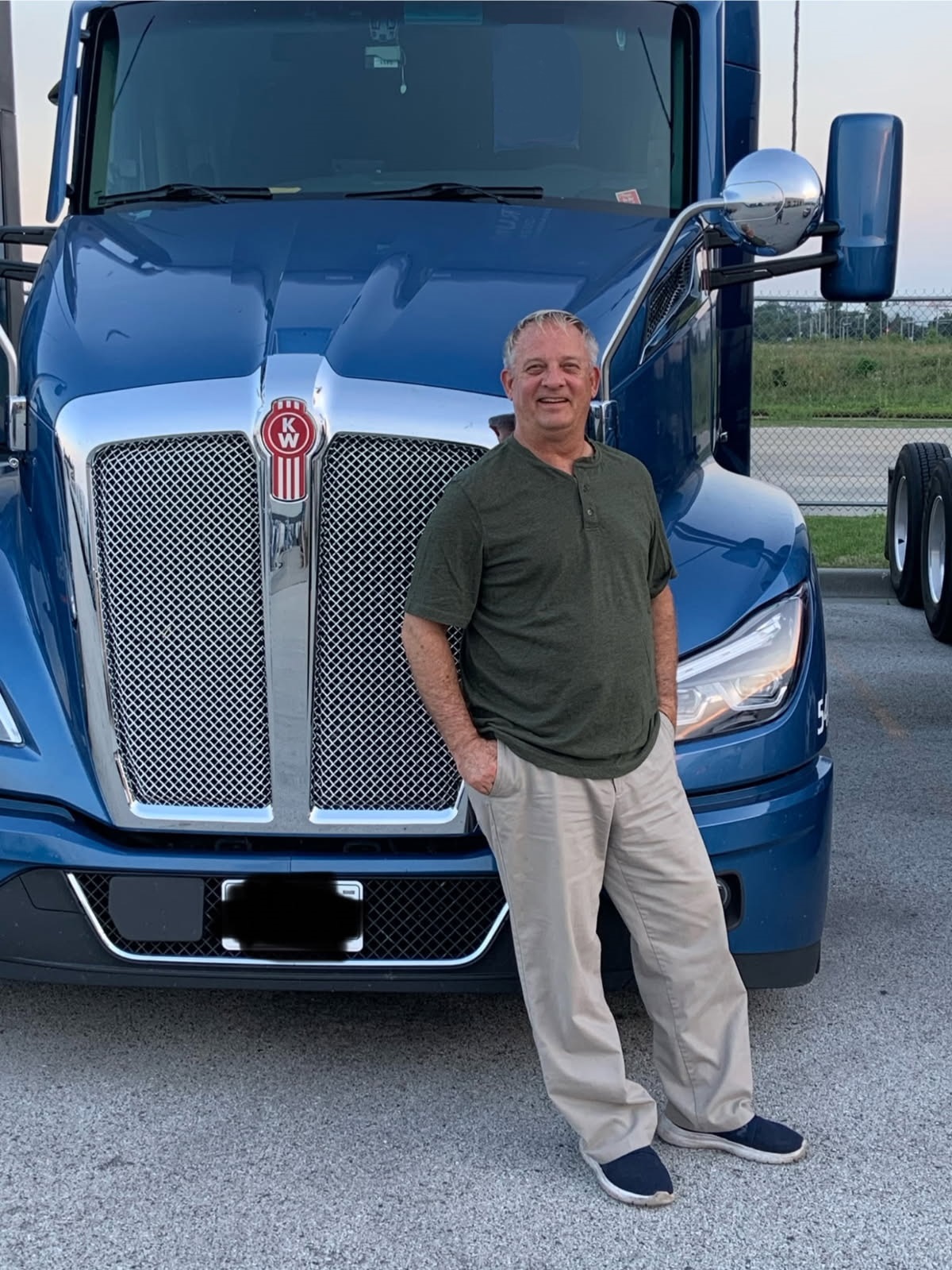 Mike Noack standing in front of his Kenworth truck in Kankakee County, Illinois